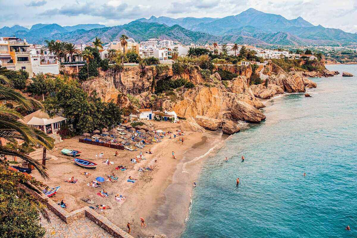 Beautiful Nerja coastal town with dramatic cliffs and beach